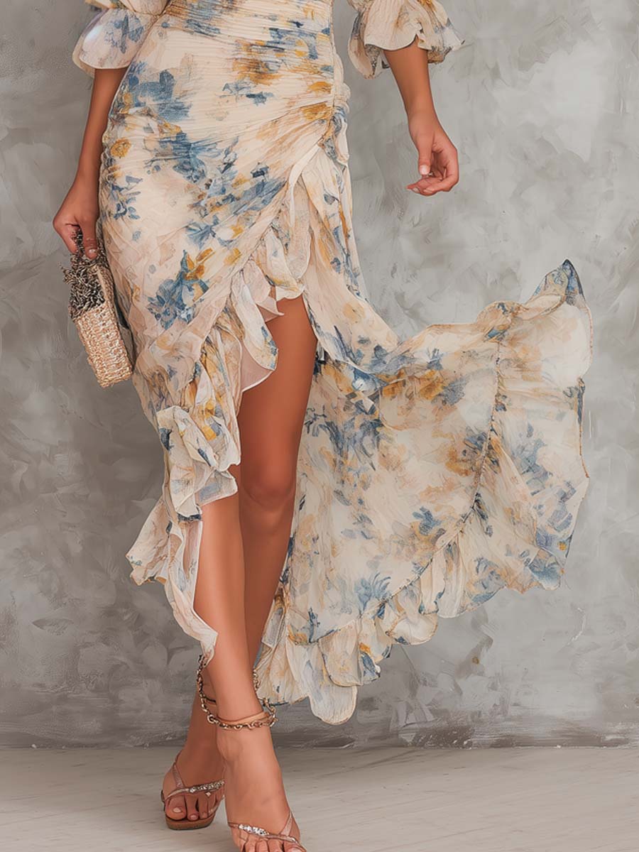 Vestido maxi beige de gasa con cuello alto, estampado floral efecto pintura al óleo y dobladillo asimétrico