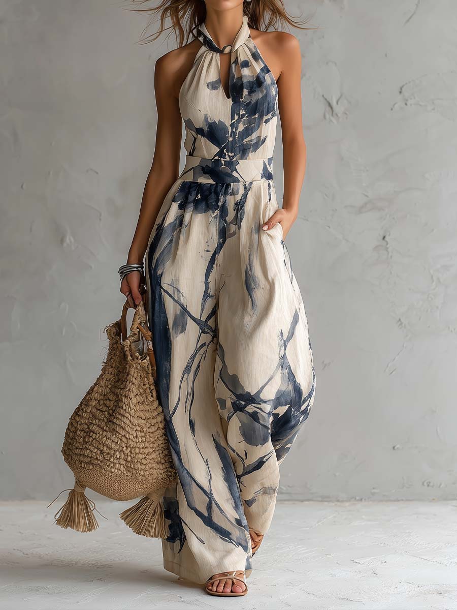 Mono largo con escote halter, estampado efecto tinta degradada, pierna ancha y prácticos bolsillos