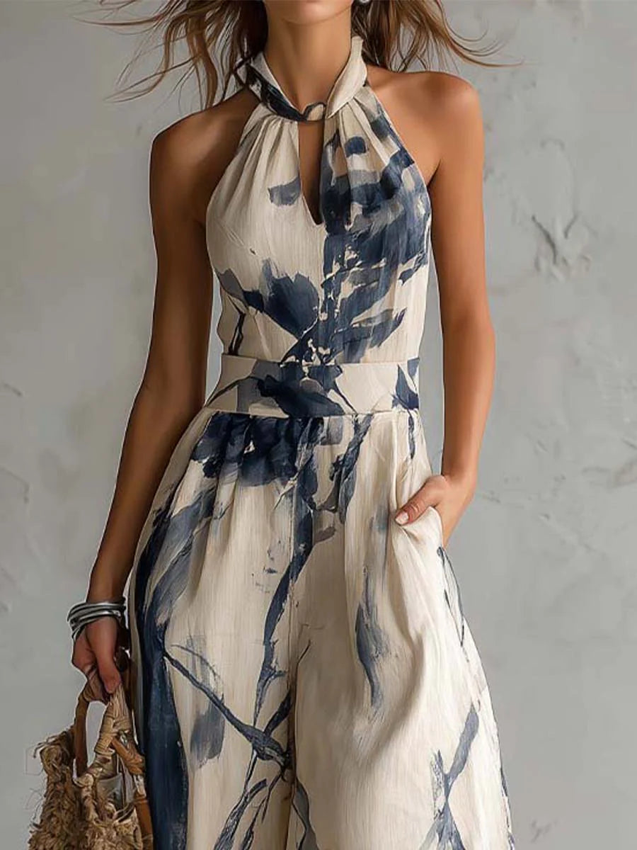 Mono largo con escote halter, estampado efecto tinta degradada, pierna ancha y prácticos bolsillos