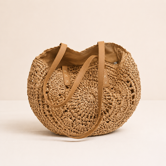 Lola | Bolso redondo de paja trenzada con motivo decorativo — Coñac